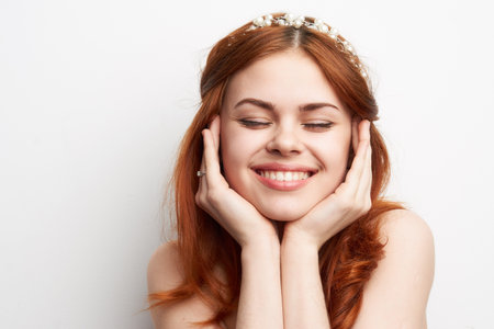 woman bare shoulders red hair makeup glamor smile model