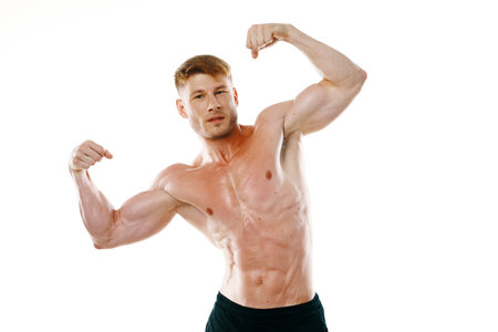 male athlete with pumped up muscular body posing fitness