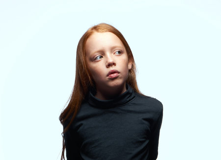 red-haired girl in a black sweater planning close-up