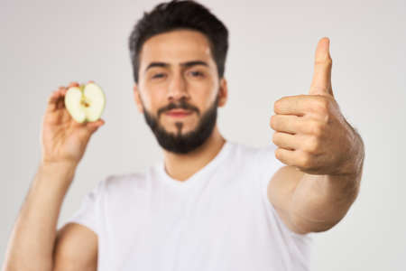 emotional bearded man with apple in his hands fruit snackの写真素材
