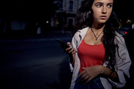 pretty woman with phone in hands communication walk lifestyleの写真素材