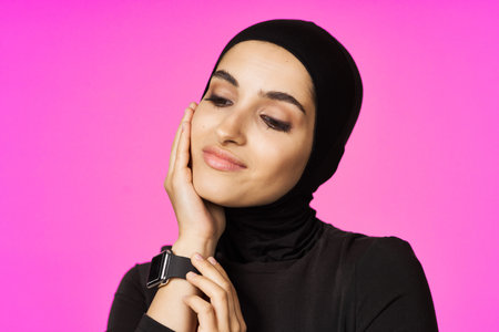 muslim woman in black hijab smart watch technology entertainment