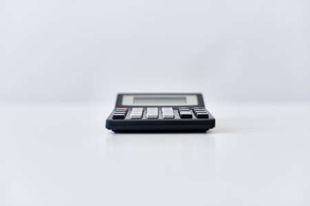 wireless keyboard on desktop cup documents officeの写真素材