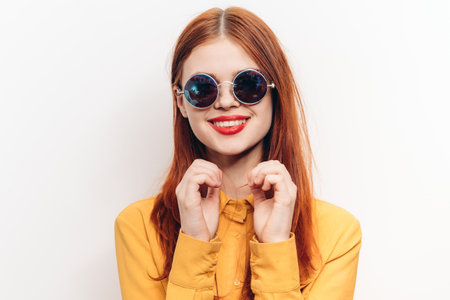 cheerful attractive woman in yellow shirt fashionable clothes sunglasses