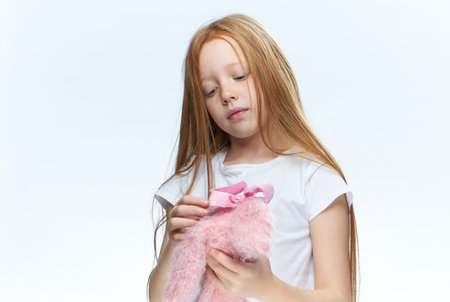 girl with stuffed toy posing fashion fun funの写真素材