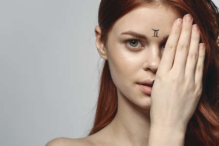cheerful woman with makeup on her face zodiac sign Gemini astronomy modelの写真素材