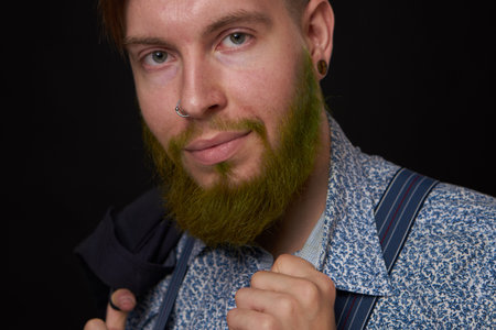 bearded man elegant style shirt dark background