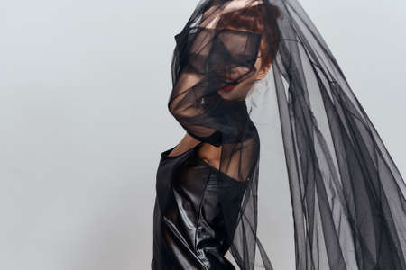 woman in black dress cosmetics emotions posing glamorの写真素材