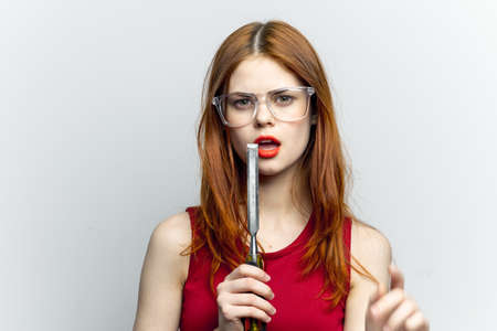 woman with glasses construction tool repair houseworkの写真素材
