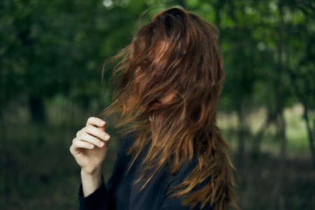 woman in black dress in the forest Halloween Witch costumeの写真素材
