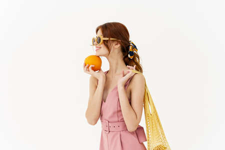 woman in pink dress glamor posing model isolated backgroundの写真素材