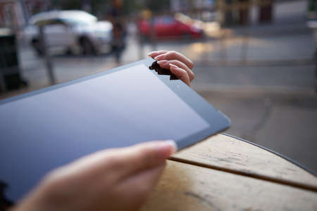 woman in cafe with tablet technology communication deviceの写真素材