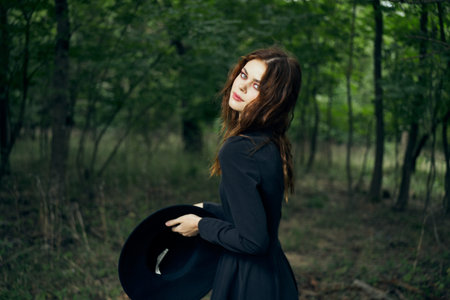 cheerful woman witch in the forest posing fantasy
