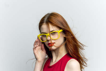 pretty woman yellow glasses hairstyle fashion close-upの写真素材