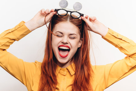 cheerful attractive woman in yellow shirt fashionable clothes sunglasses
