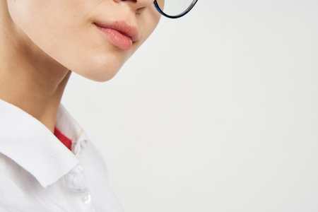 women in white shirt glasses posing color background
