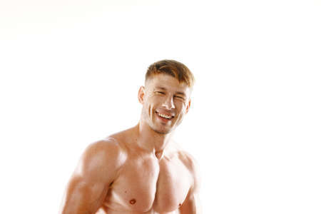 male athlete with pumped up muscular body posing fitnessの写真素材