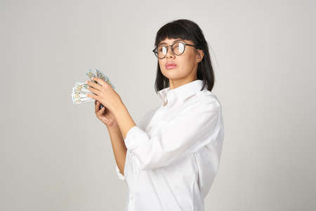 Business woman money lifestyle light background studioの写真素材