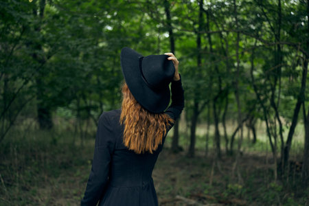 cheerful woman witch in the forest posing fantasyの写真素材