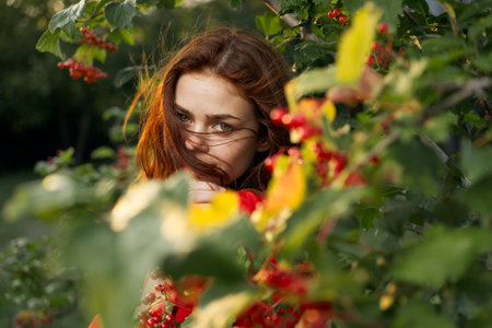 beautiful woman bush with berries nature fresh air