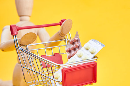 wooden dummy with medicine cart yellow background