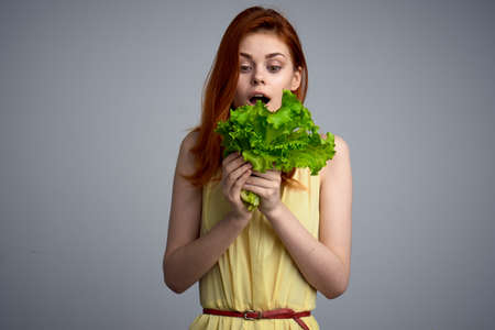 woman with lettuce leaf healthy food diet lifestyleの写真素材