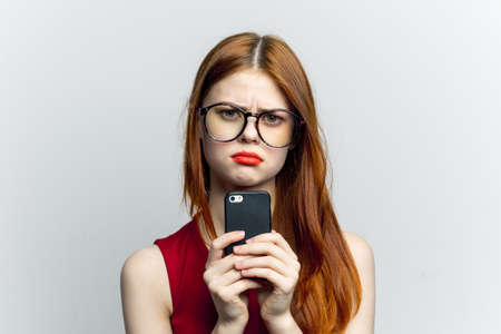pretty woman with glasses talking on the phone technology lifestyleの写真素材