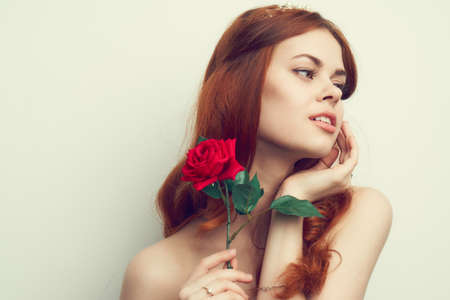 cheerful woman fashion hairstyle rose flower charm romanceの写真素材