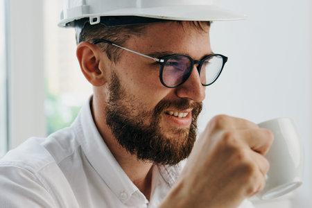 man in white helmet working table technology and professional