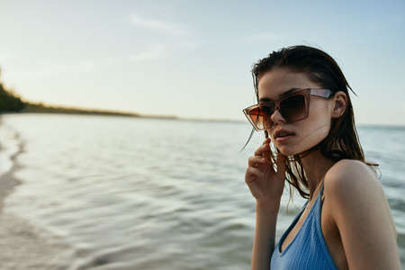 woman in swimsuit jungle exotic tropical green leavesの写真素材