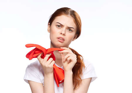 cleaning lady with rubber gloves emotions cleaning the houseの写真素材