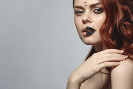 pretty woman defensive shoulders posing cosmetics zodiac sign Geminiの写真素材