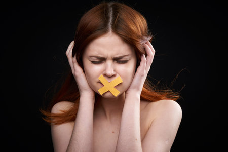 woman with bare shoulders taped mouth banned from diet