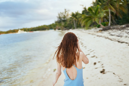woman in blue swimsuit on the beach island lifestyleの写真素材