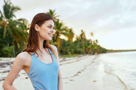 woman in blue swimsuit on the beach island lifestyleの写真素材