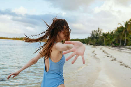 woman in blue swimsuit on the beach island lifestyleの写真素材