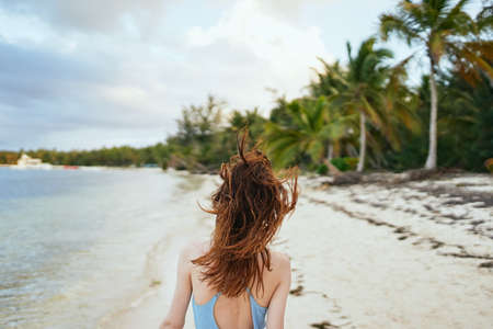 woman in blue swimsuit on the beach island lifestyleの写真素材