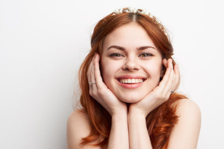 woman bare shoulders red hair makeup glamor smile modelの写真素材