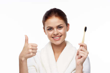 Woman in white coat toothbrush oral hygieneの写真素材