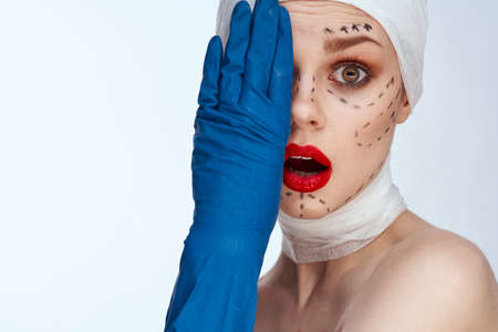 beautiful woman Red lips plastic surgery operation bare shoulders light backgroundの写真素材