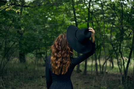 cheerful woman witch in the forest posing fantasyの写真素材