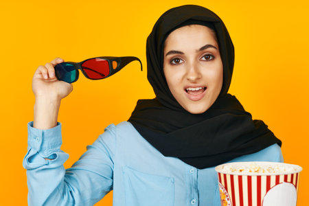 Muslim joy leisure posing fashion yellow backgroundの写真素材