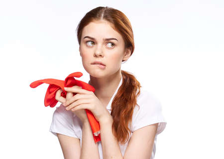 cleaning lady with rubber gloves emotions cleaning the houseの写真素材