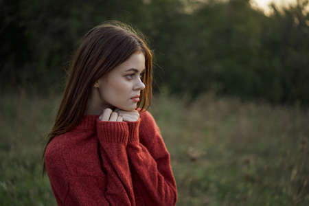 woman outdoors in a field walk fresh airの写真素材