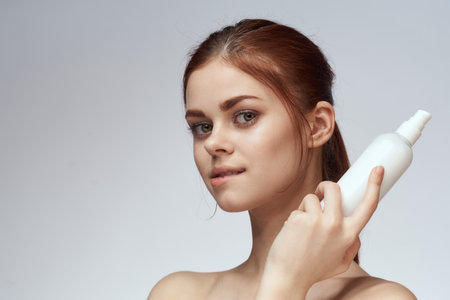 woman with lotion in hands clean skin care health close-upの写真素材