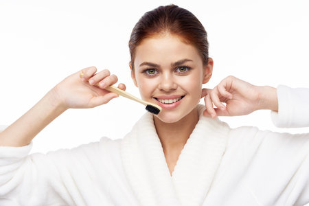 Woman in white coat toothbrush oral hygiene