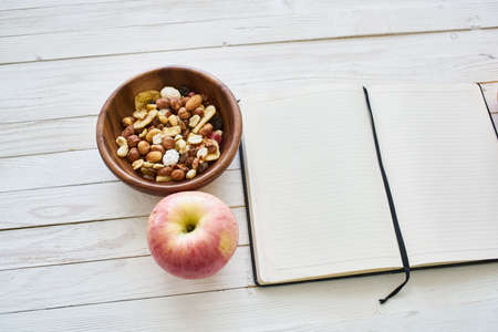 notepad on table measuring tape fruit breakfast nutritional fitnessの写真素材
