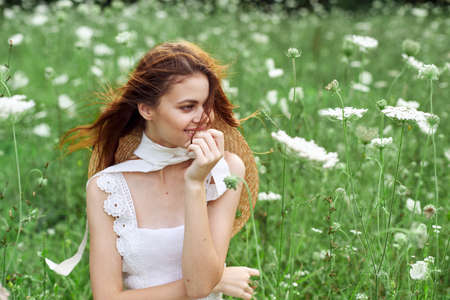 cheerful women in white dress and posing nature luxuryの写真素材