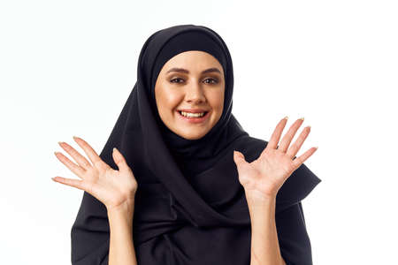 muslim woman with black hijab gifts holiday close-upの写真素材