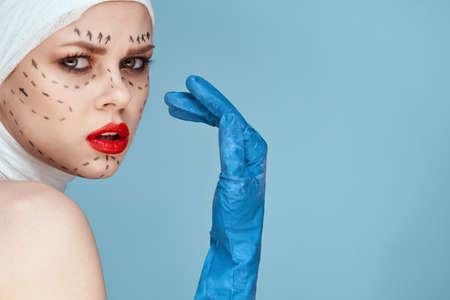 woman Red lips plastic surgery operation bare shoulders isolated backgroundの写真素材